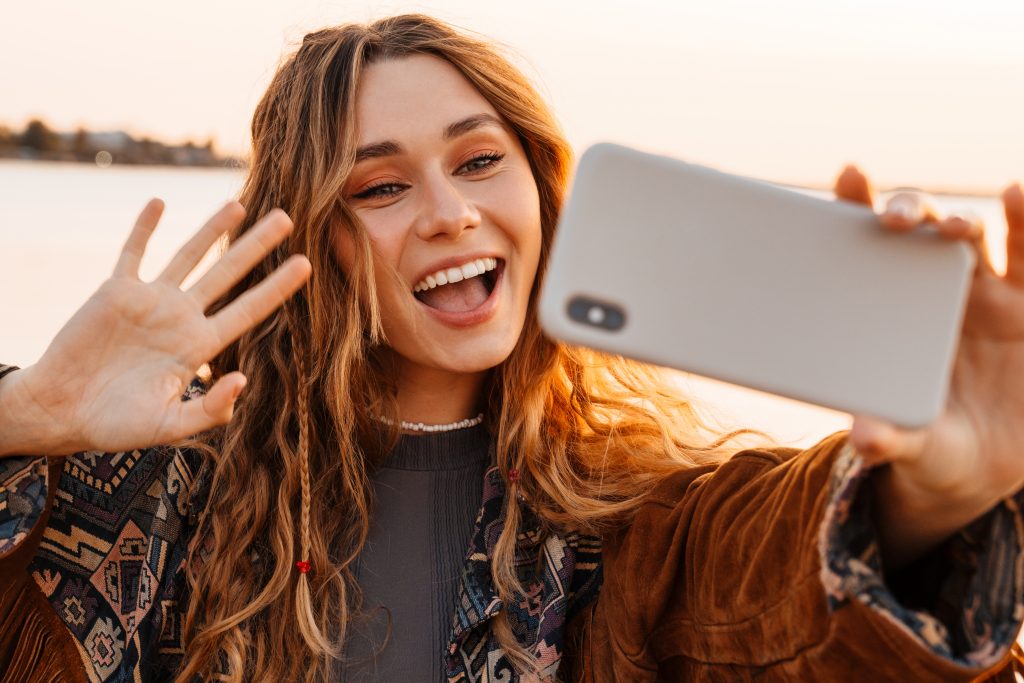 woman talking by smartphone B679MV3